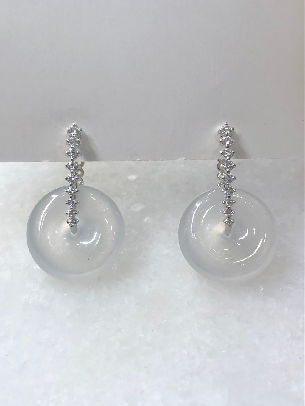 Natural Type A highly translucent, near glassy icy white jadeite safety coin earrings set in 18K white gold and natural diamonds | ClassicJade Singapore
