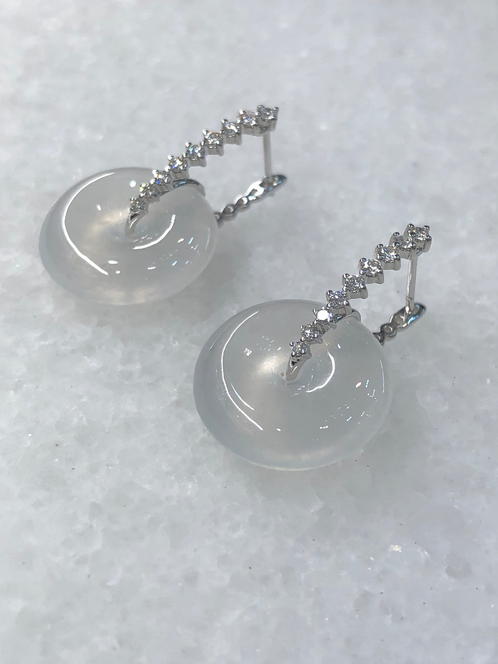 Natural Type A highly translucent, near glassy icy white jadeite safety coin earrings set in 18K white gold and natural diamonds | ClassicJade Singapore