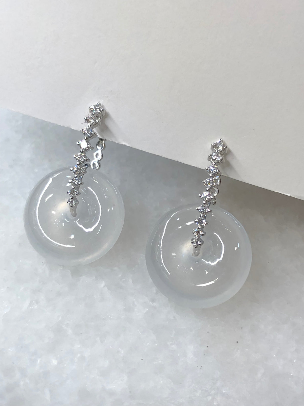 Natural Type A highly translucent, near glassy icy white jadeite safety coin earrings set in 18K white gold and natural diamonds | ClassicJade Singapore